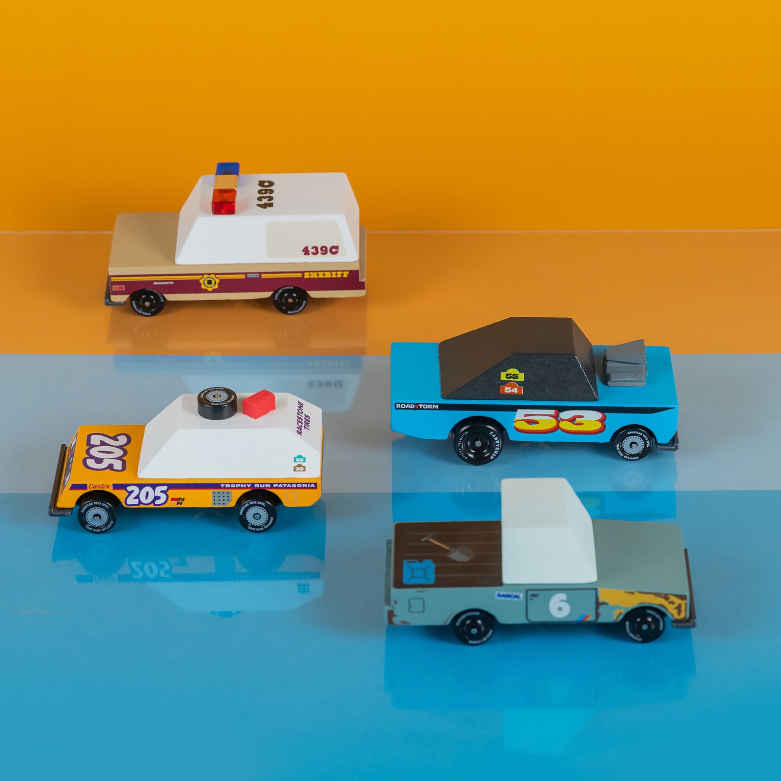 Four toy cars on a white background