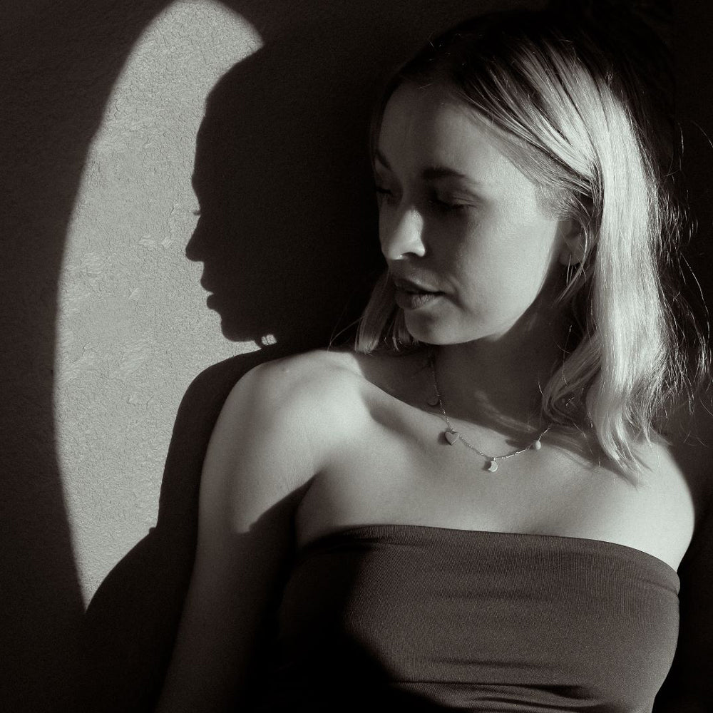 Necklace with colorful round pendants on a white background