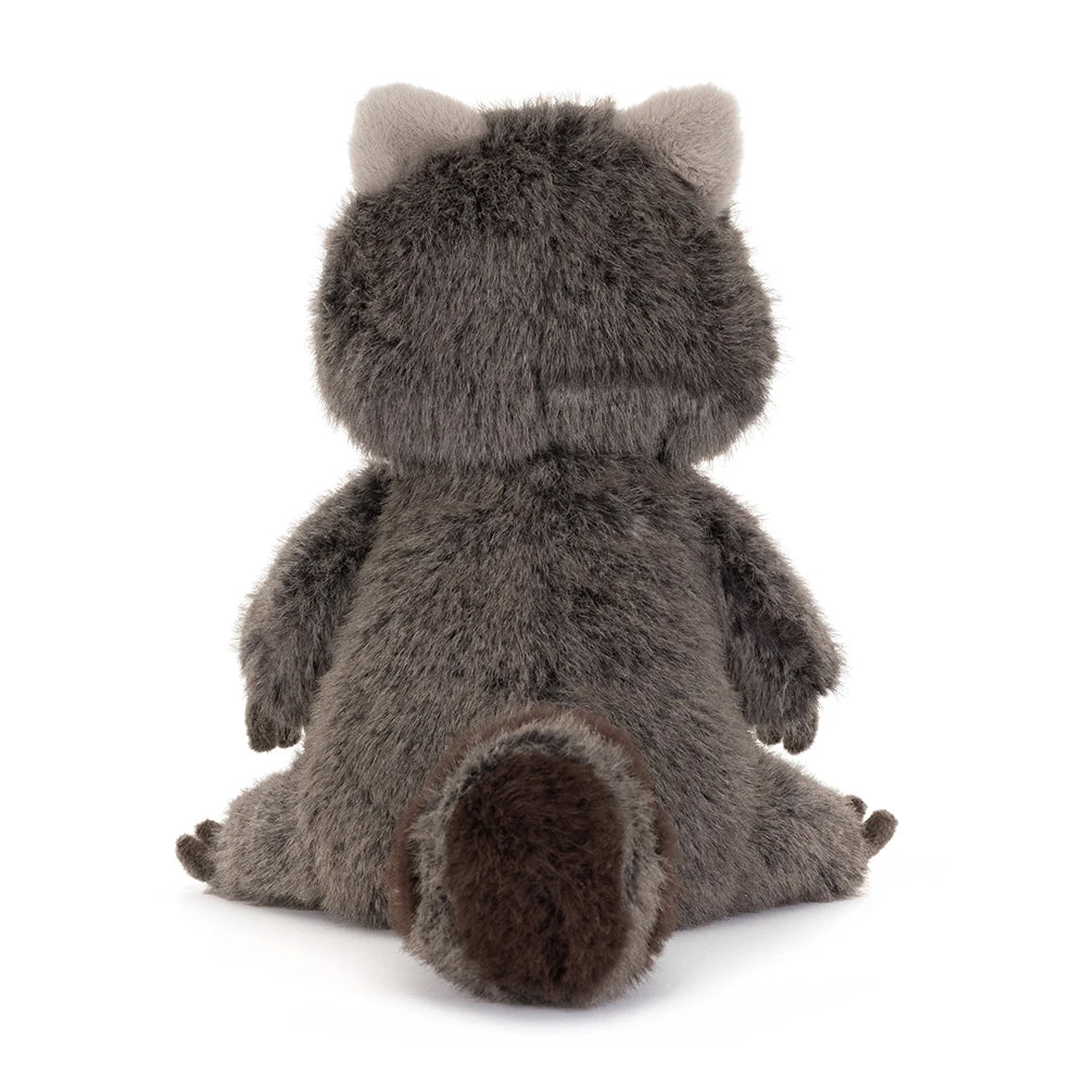 Plush toy raccoon from behind on a white background