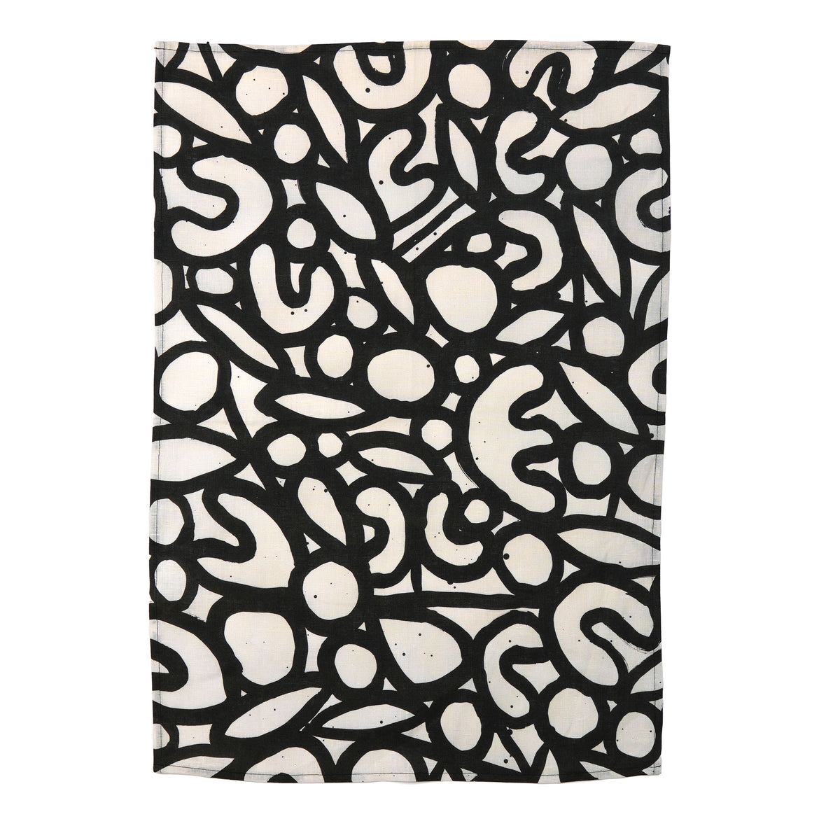 A rectangular tea towel, featuring an abstract black and off-white organic pattern on a plain white background.