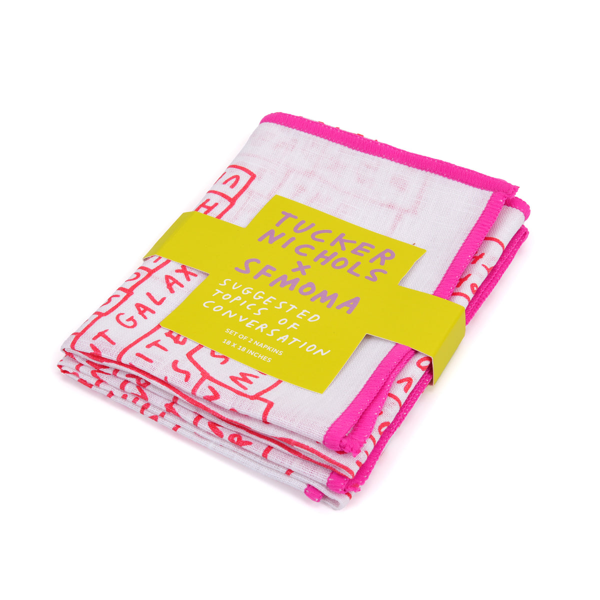 Folded white cotton napkins with hot pink and red graphic text patterns, wrapped in a bright yellow paper band.