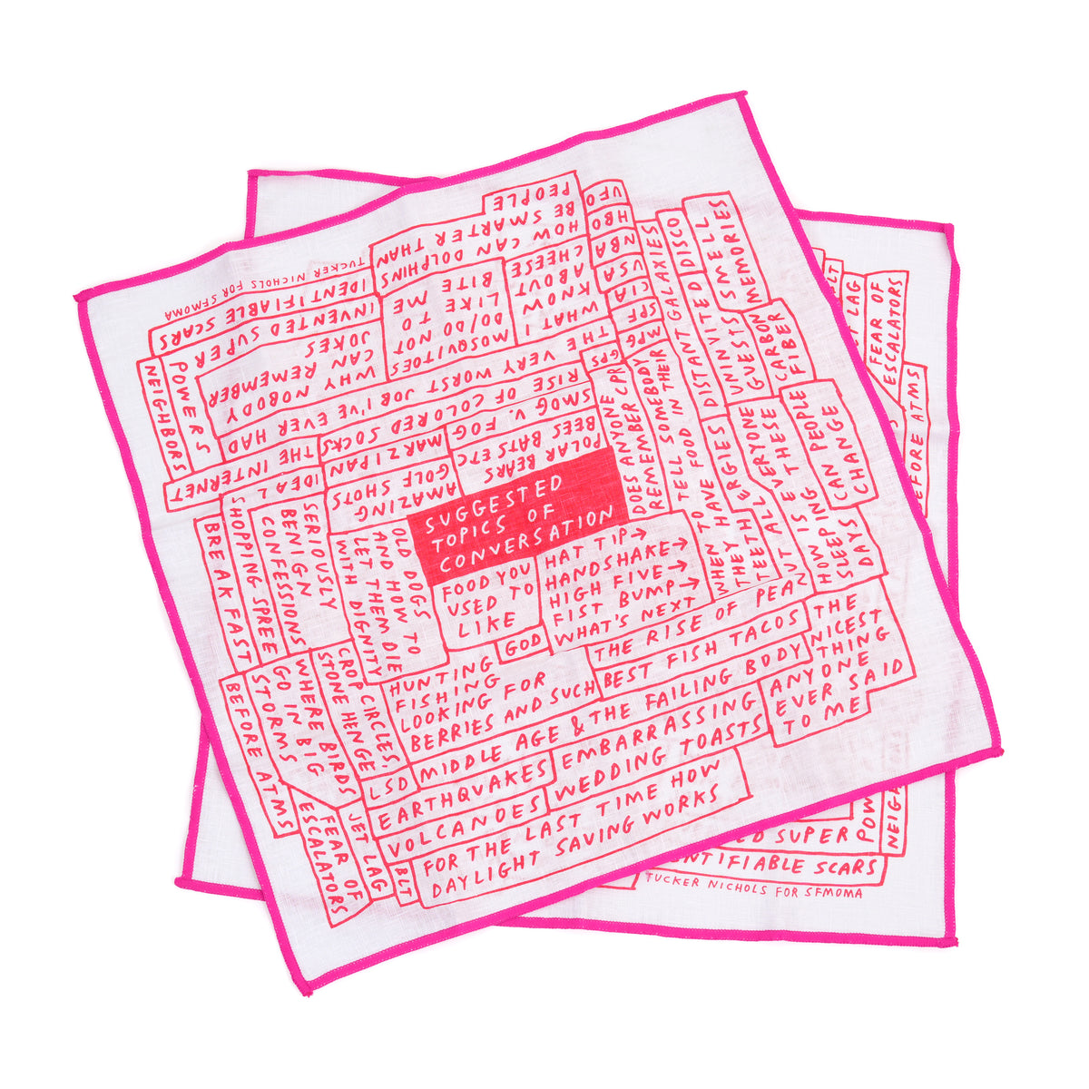 Two square white fabric napkins with bright pink borders and dense red printed text, arranged overlapping on a plain white background.