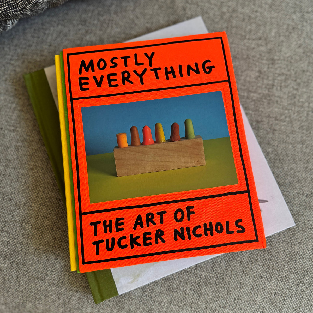 Book lifestyle on grey fabric background.