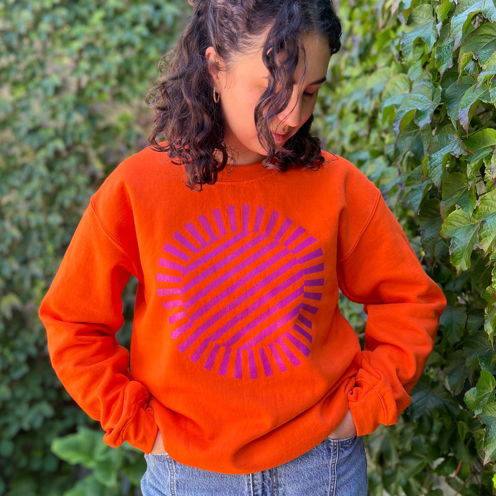 Front view of orange turret sweatshirt.