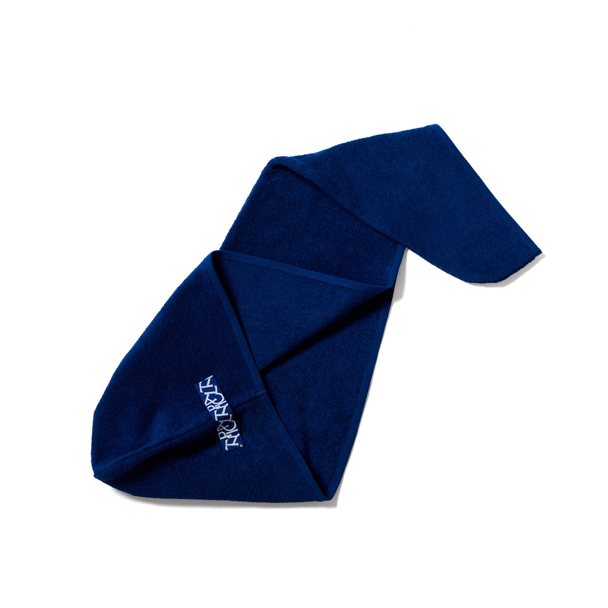 A folded dark blue towel with white embroidered text reading 'TYPICAL' on a clean white background.