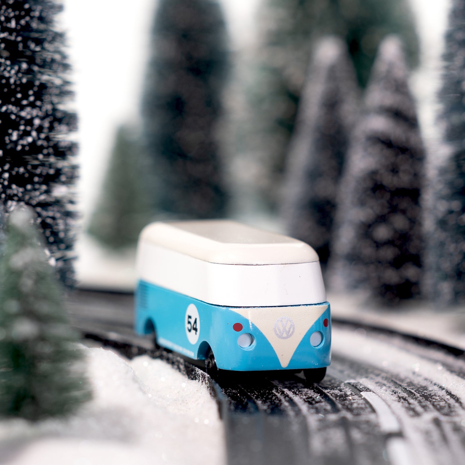 Blue and white model van with number 54 on a white background