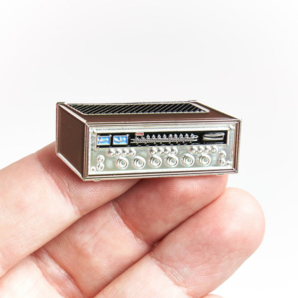 Hand holding Vintage Stereo Receiver Pin #1.