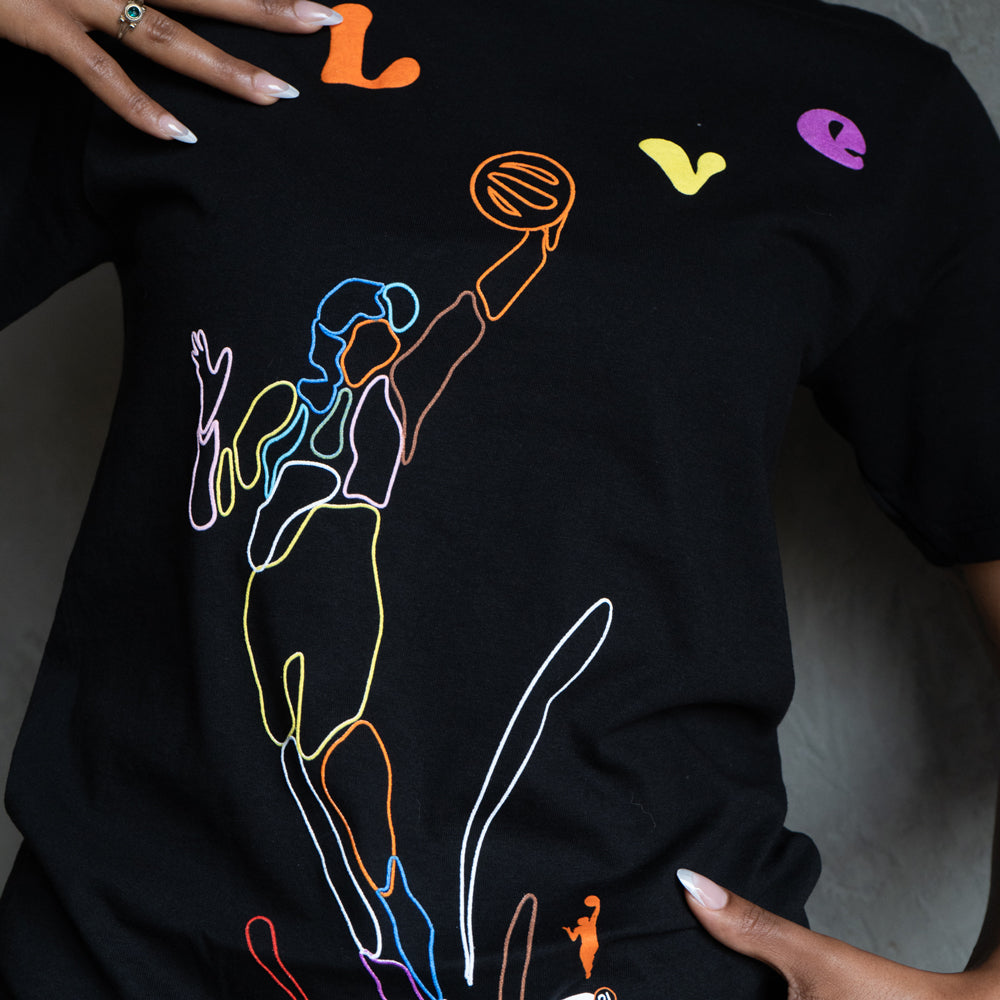 Close-up model wearing tee.