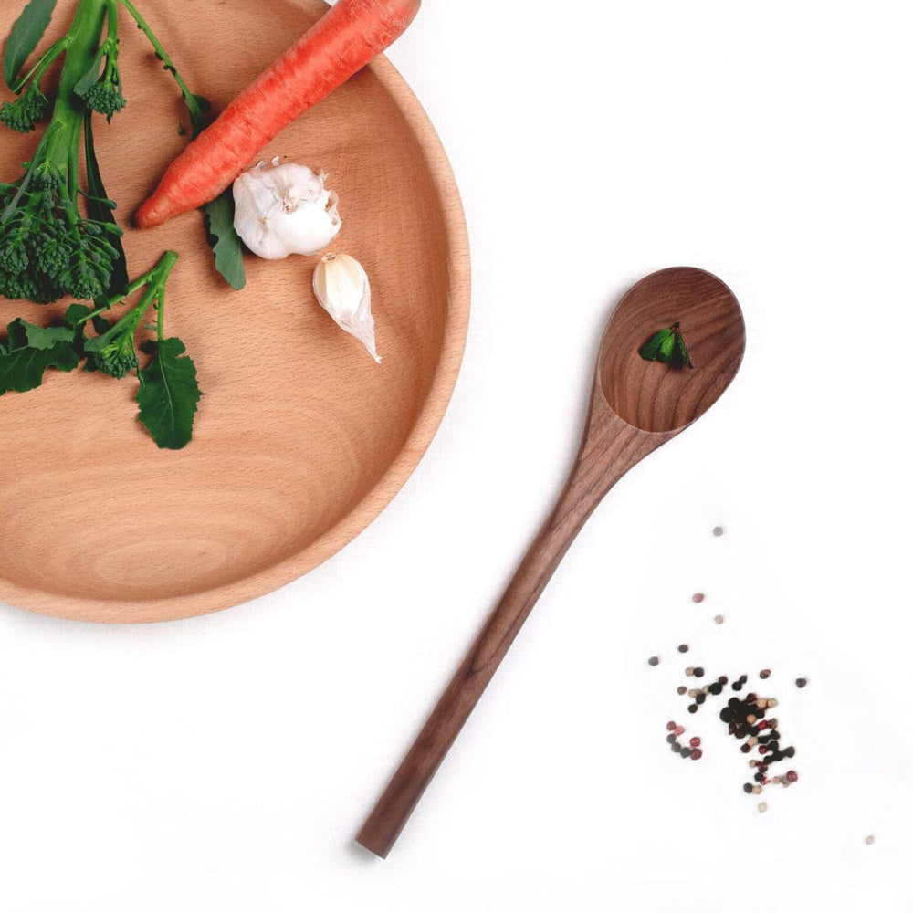Wooden spoon on a white background