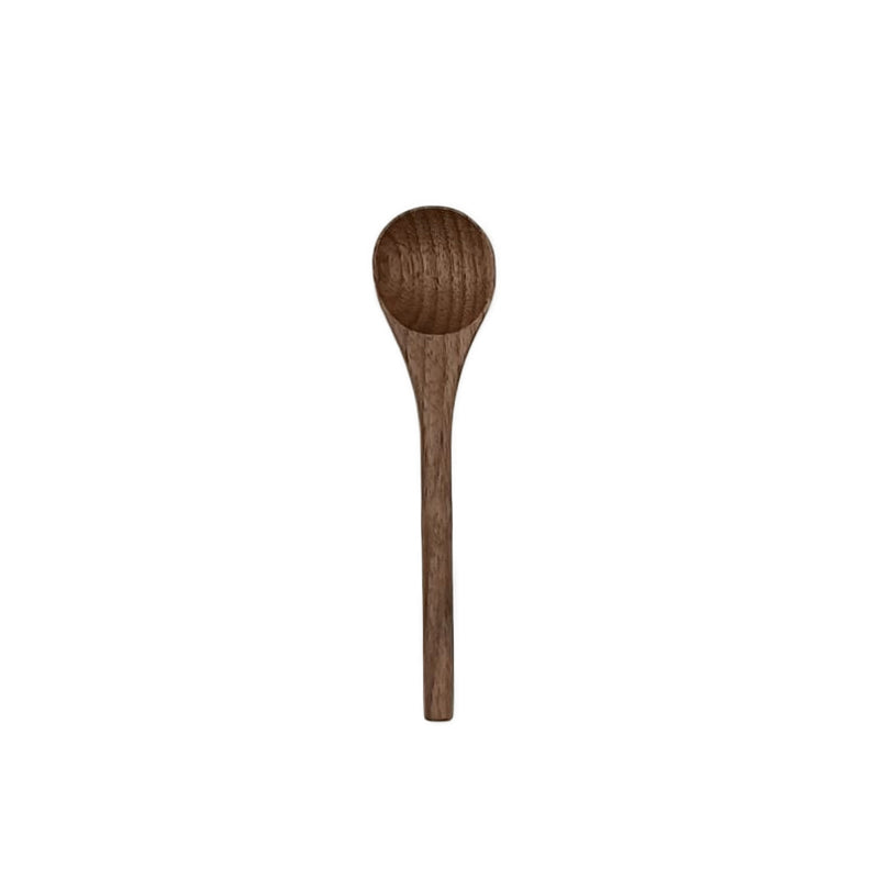 Wooden spoon on a white background