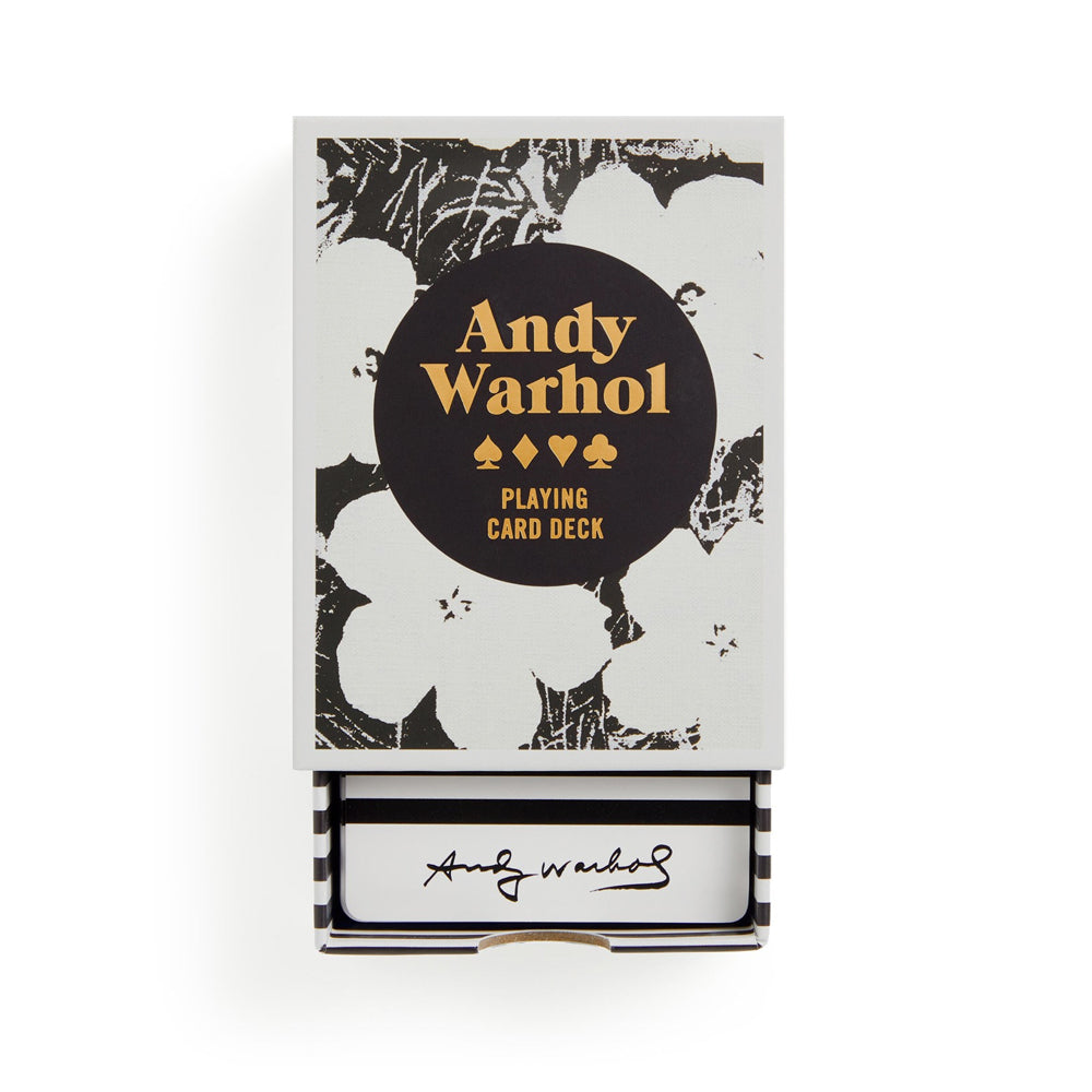 Andy Warhol playing card deck packaging with floral design and signature.