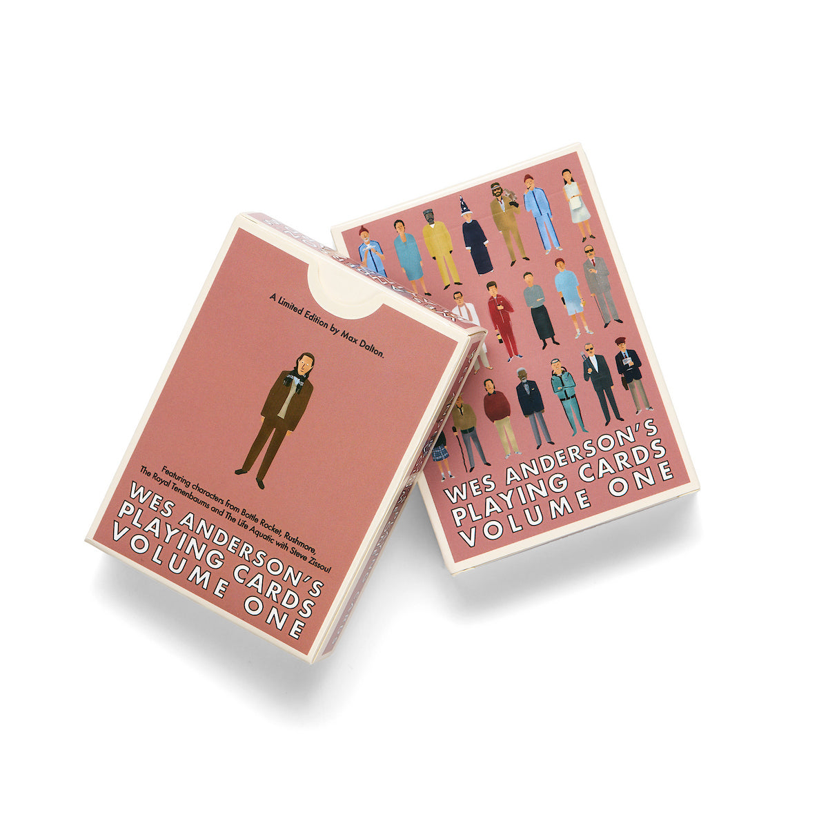 Two boxed decks of Wes Anderson's Playing Cards Volume One shown on a clean white background, with one box standing upright and the other tilted in front. The boxes are dusty pink with illustrated figures and white text.