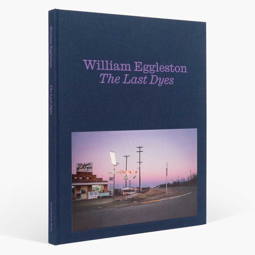 Book titled 'The Last Dyes' by William Eggleston with a cover photo of a small town scene.