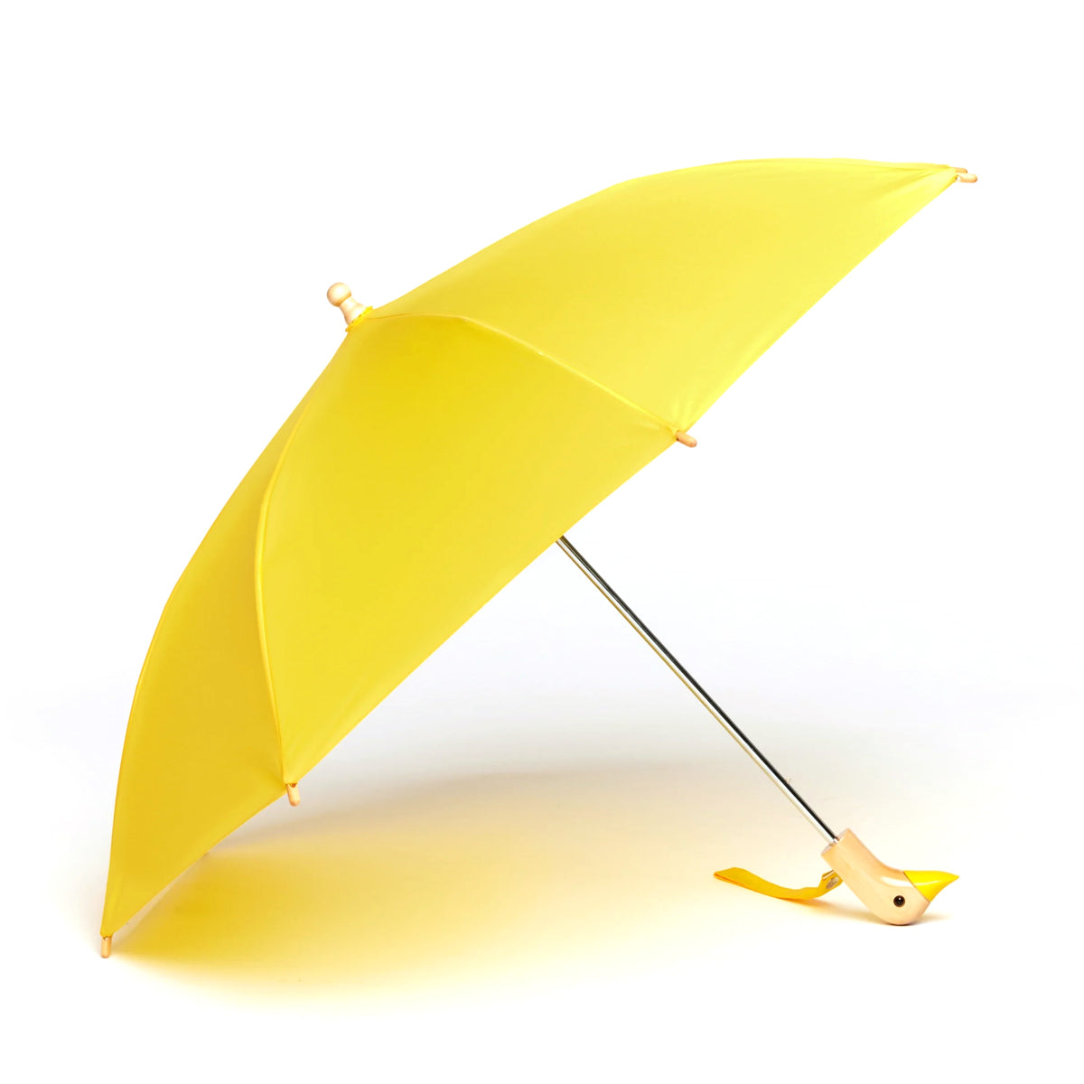 Yellow umbrella with a bird-shaped handle on a white background