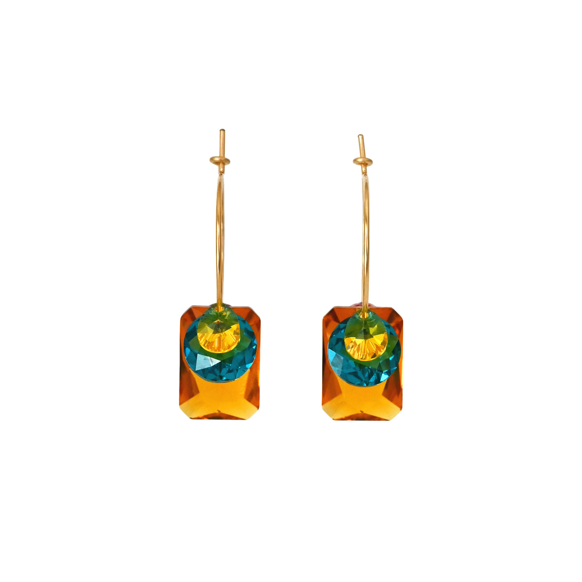 Pair of earrings with colorful gemstones on a white background