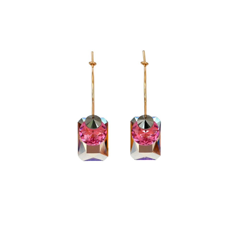 Pair of earrings with pink gemstones on a white background
