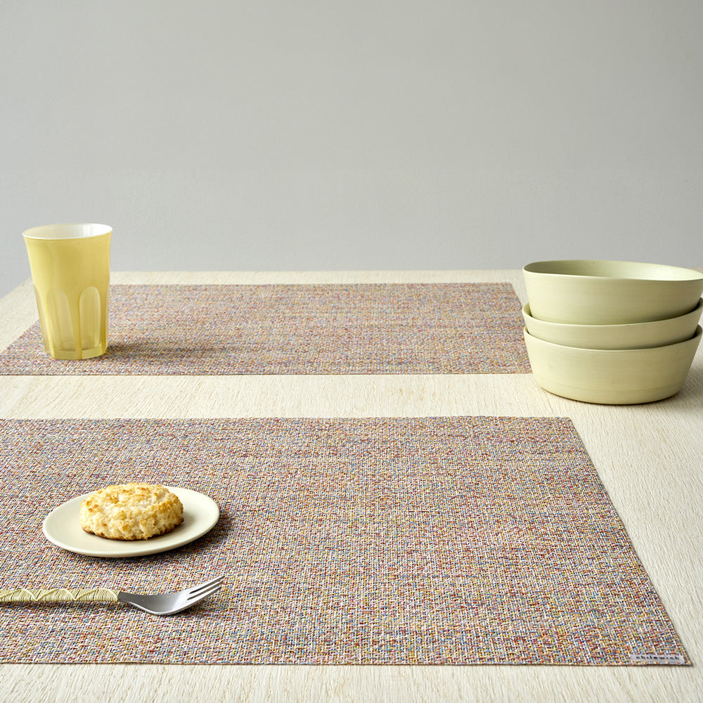 Two placemats on dining table.