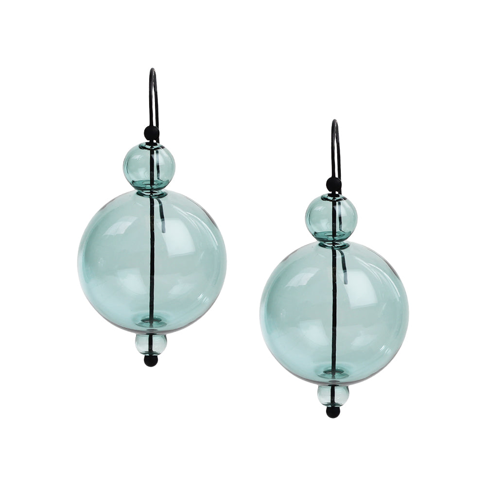 Aqua bubble earrings on display.