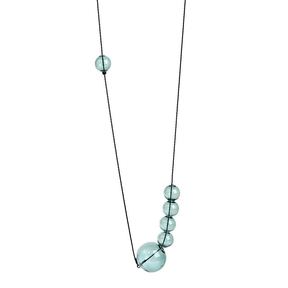 Long necklace with six aqua clear glass balls.