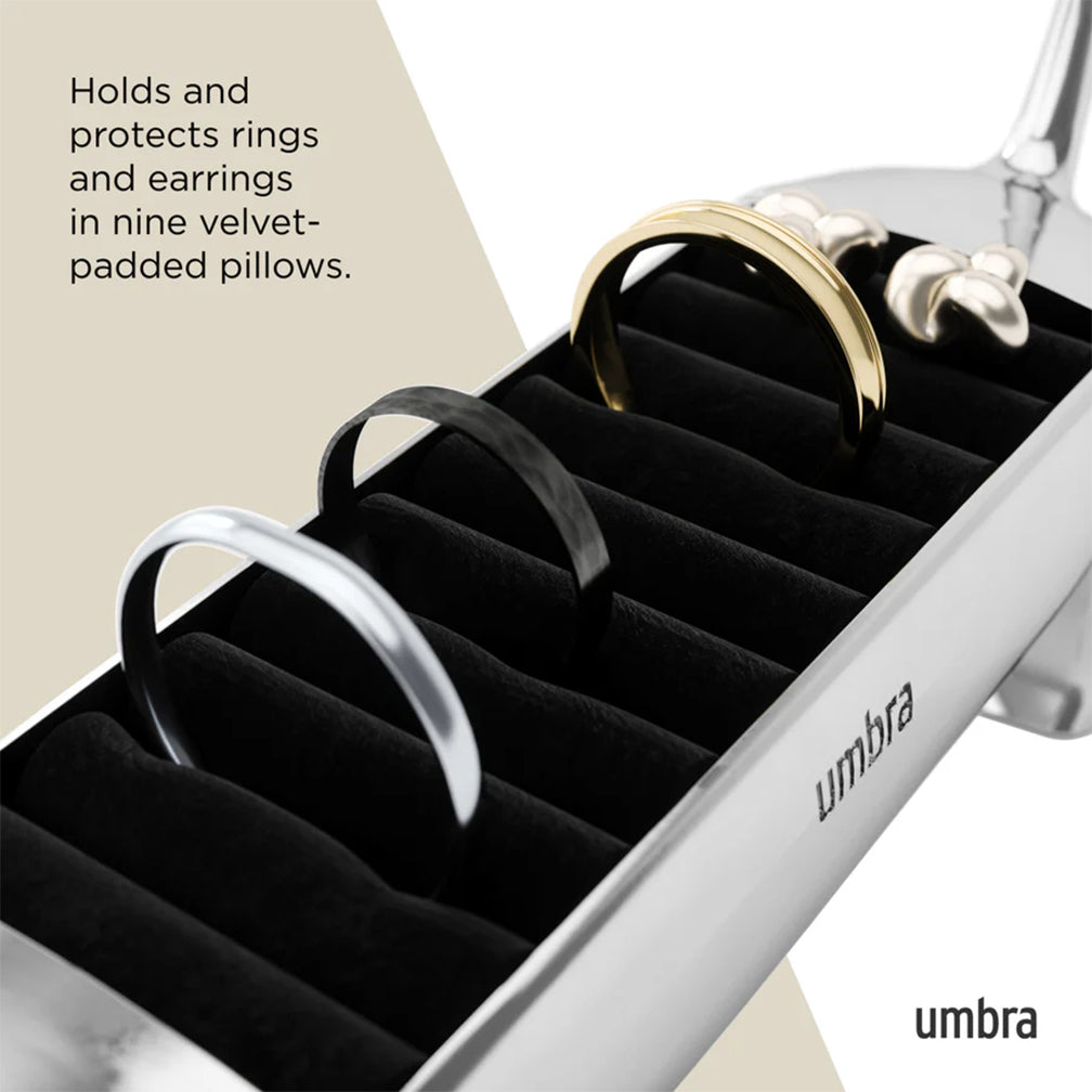 Umbra jewelry organizer with rings and earrings on a neutral background