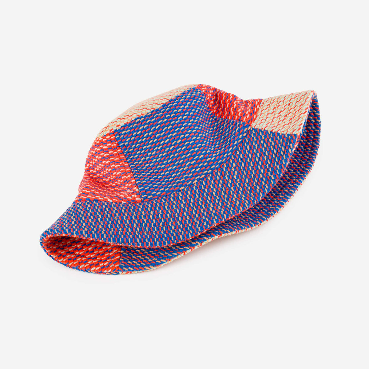 Colorful bucket hat with a geometric pattern on a light gray background