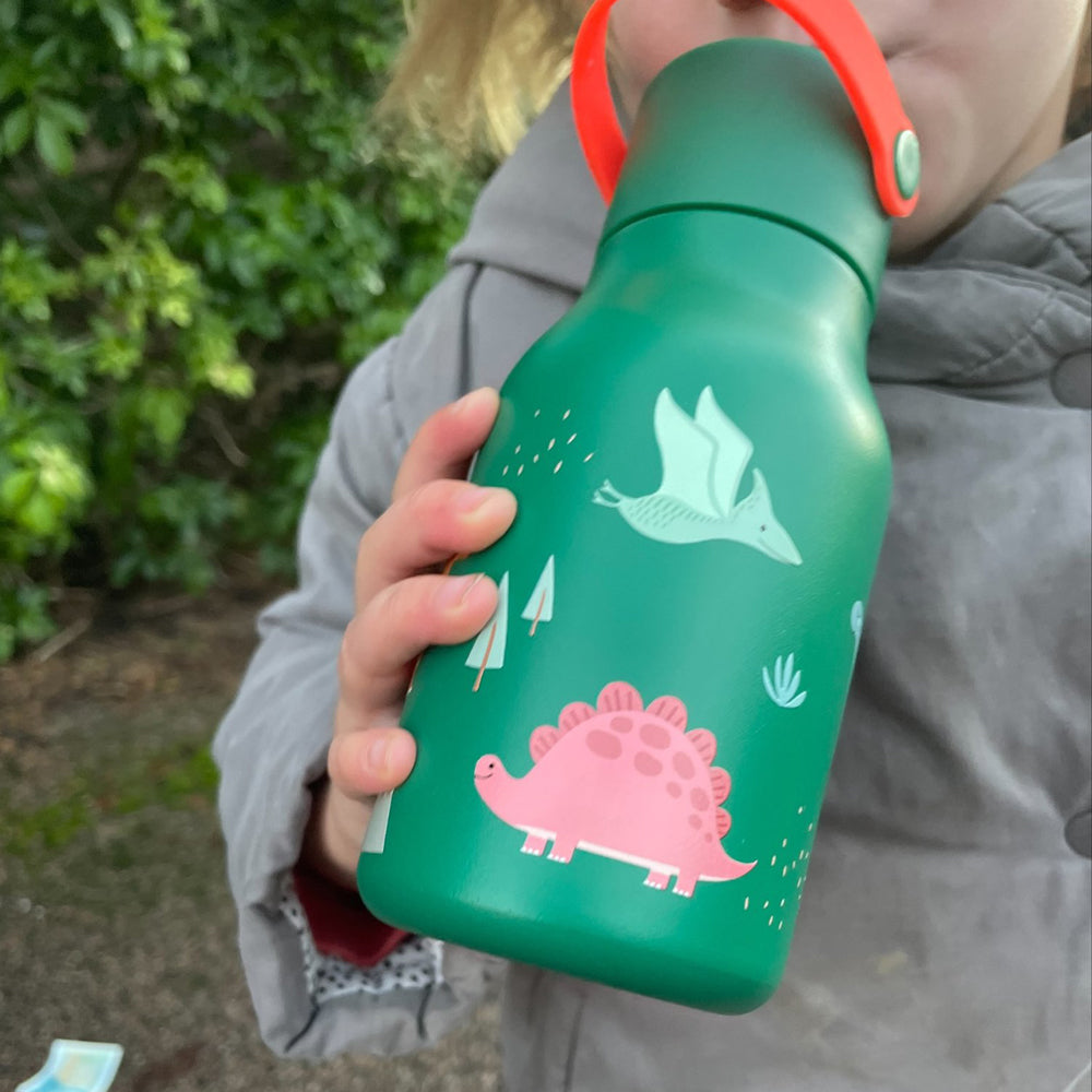 Child drinking from water bottle.