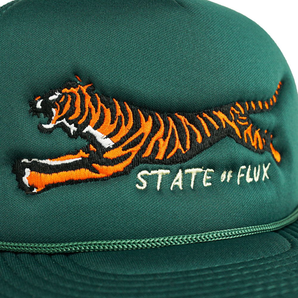 Close up view of the embroidery on the Mojo Trucker Hat: Forest Green.