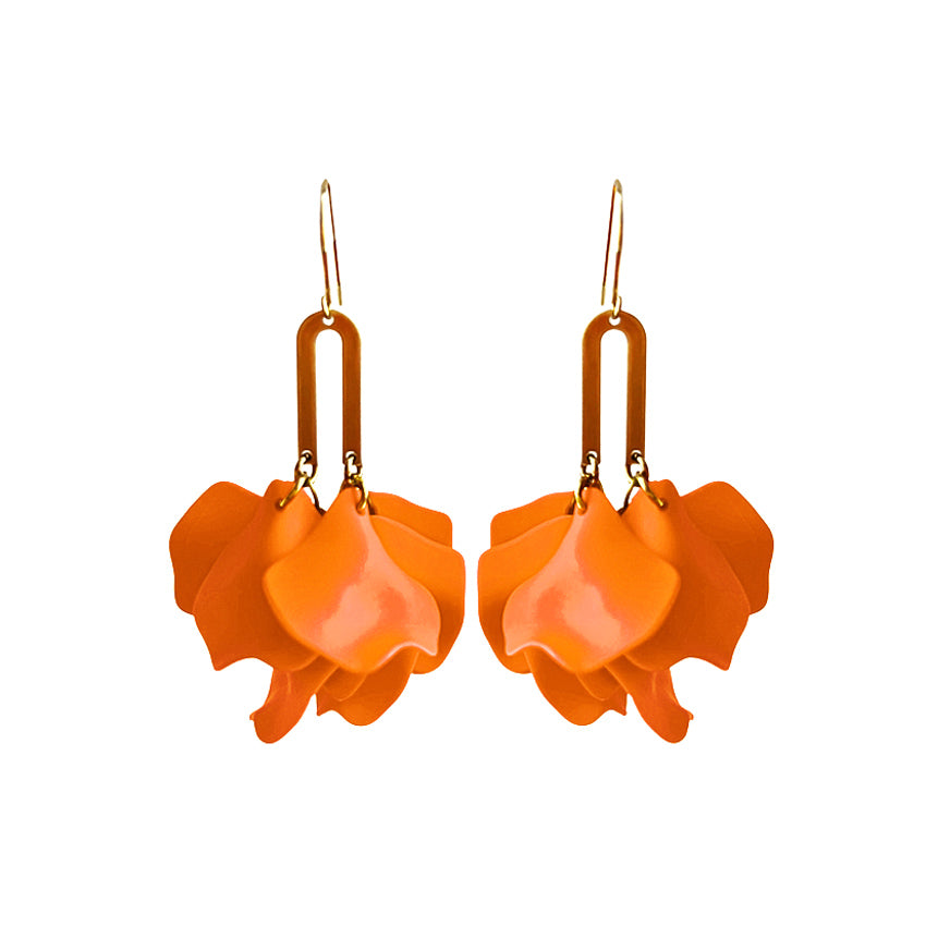 Pair of orange flower-shaped earrings on a white background