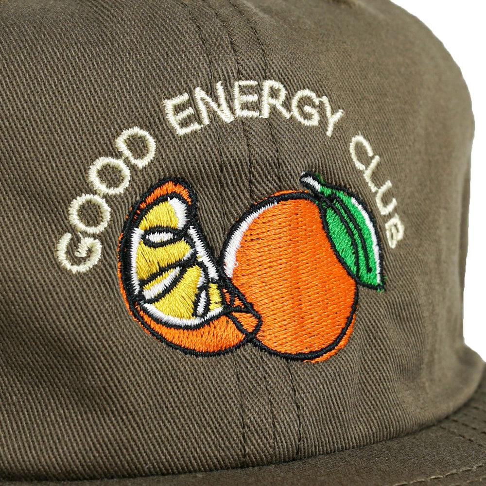 Close up of embroidery on the Good Energy Club hat.