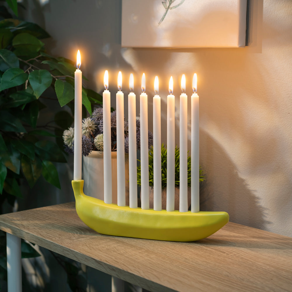 Banorah with lighted candles.