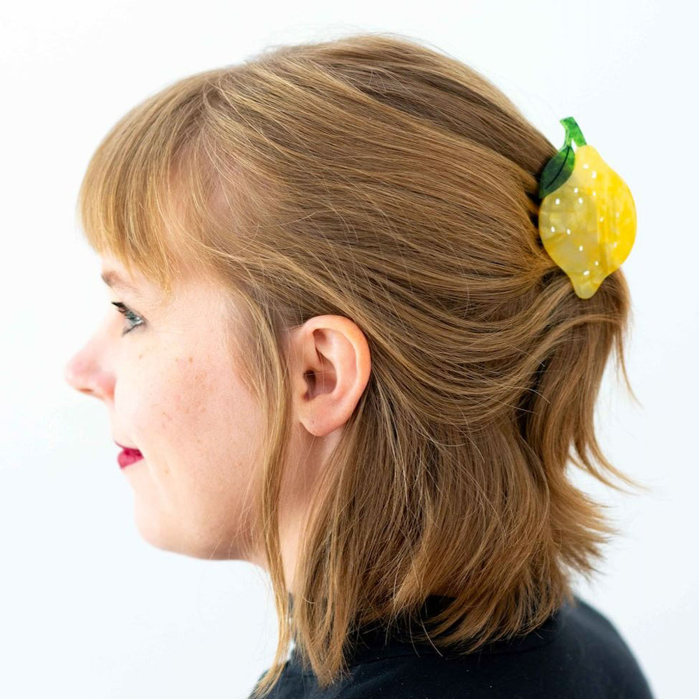 Model wearing lemon hair claw.