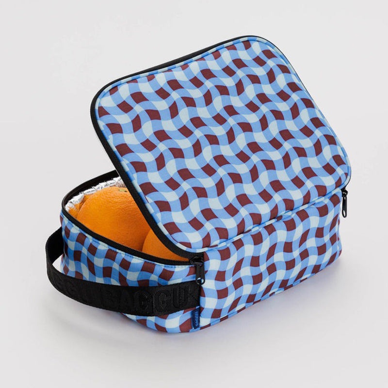 Lunch box unzipped with oranges inside.
