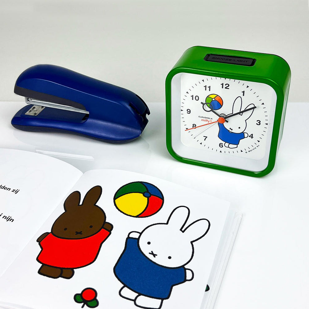 Alarm clock with desk accessories.