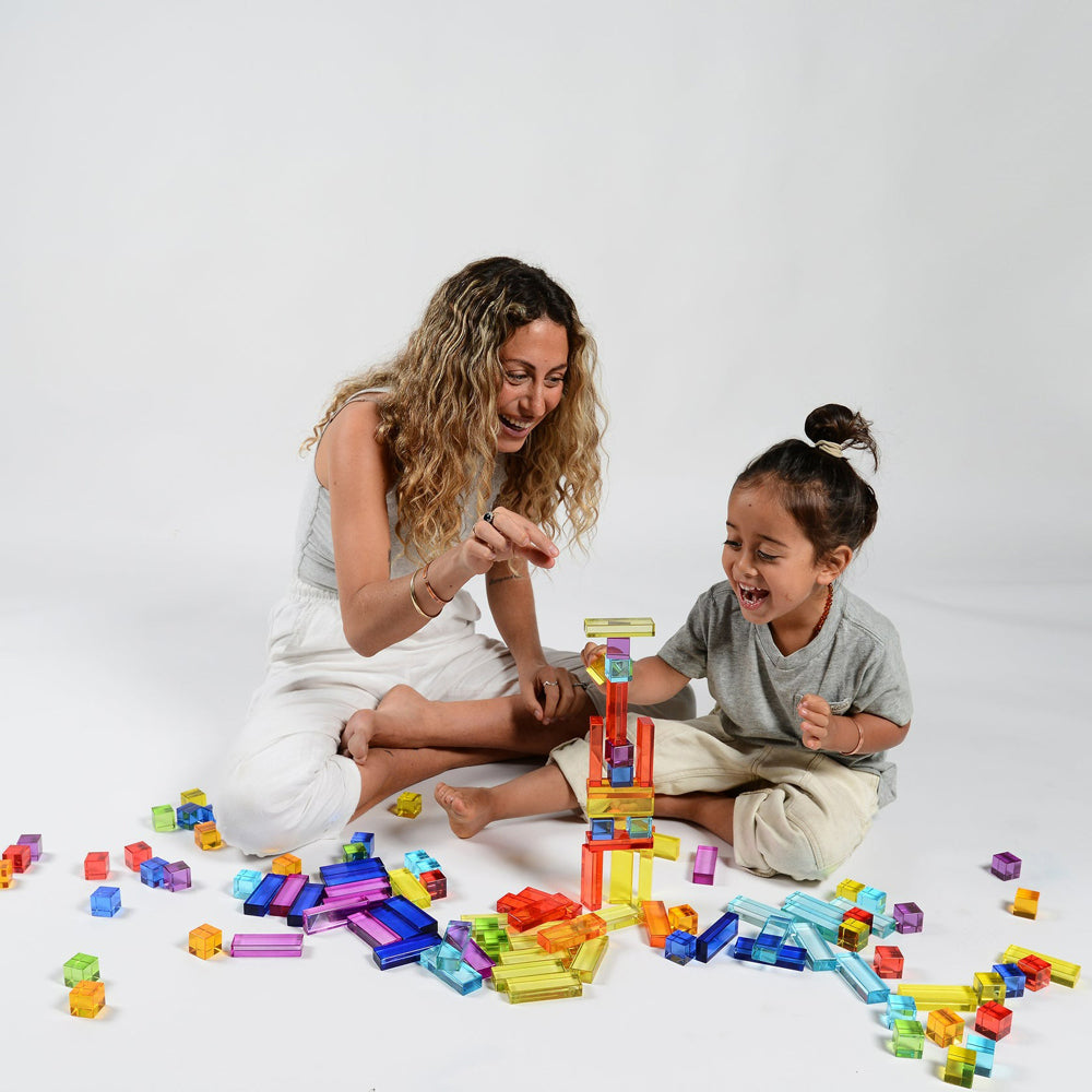Adult and child playing with pieces.
