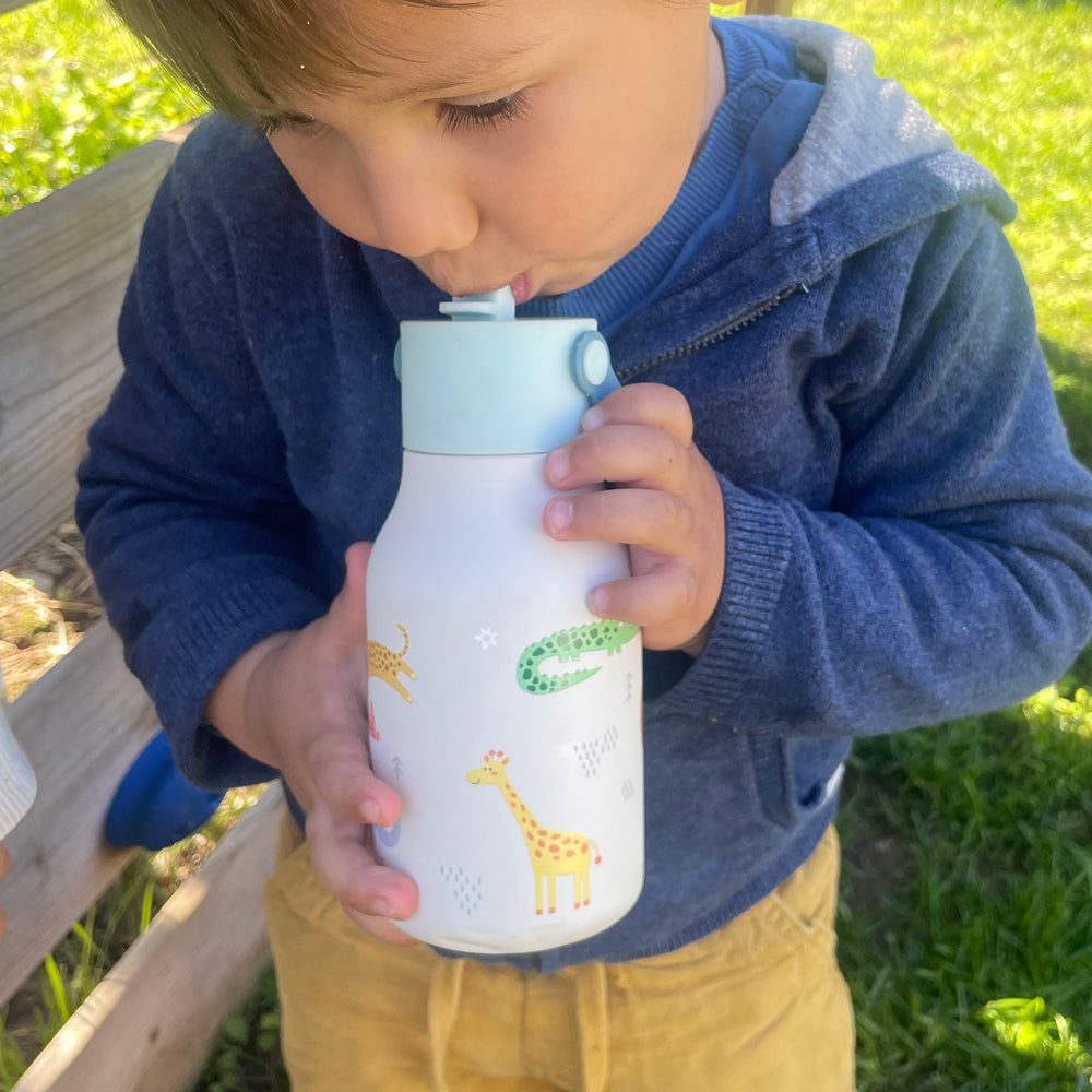 Child drinking from water bottle.