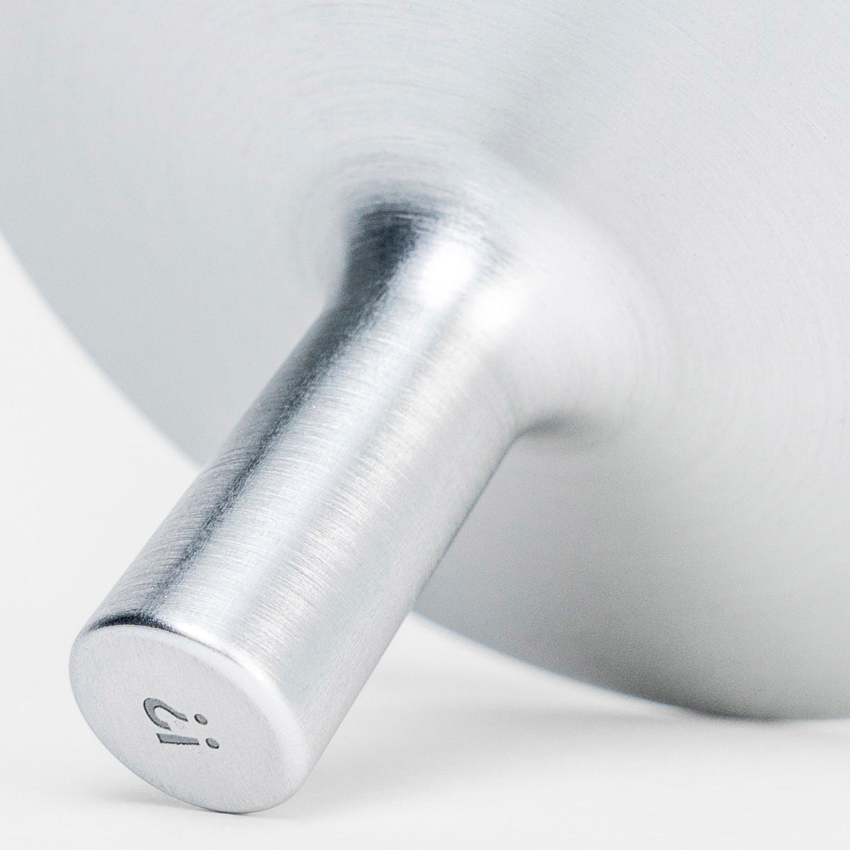 Close-up of bottle opener with a brand logo on a white background