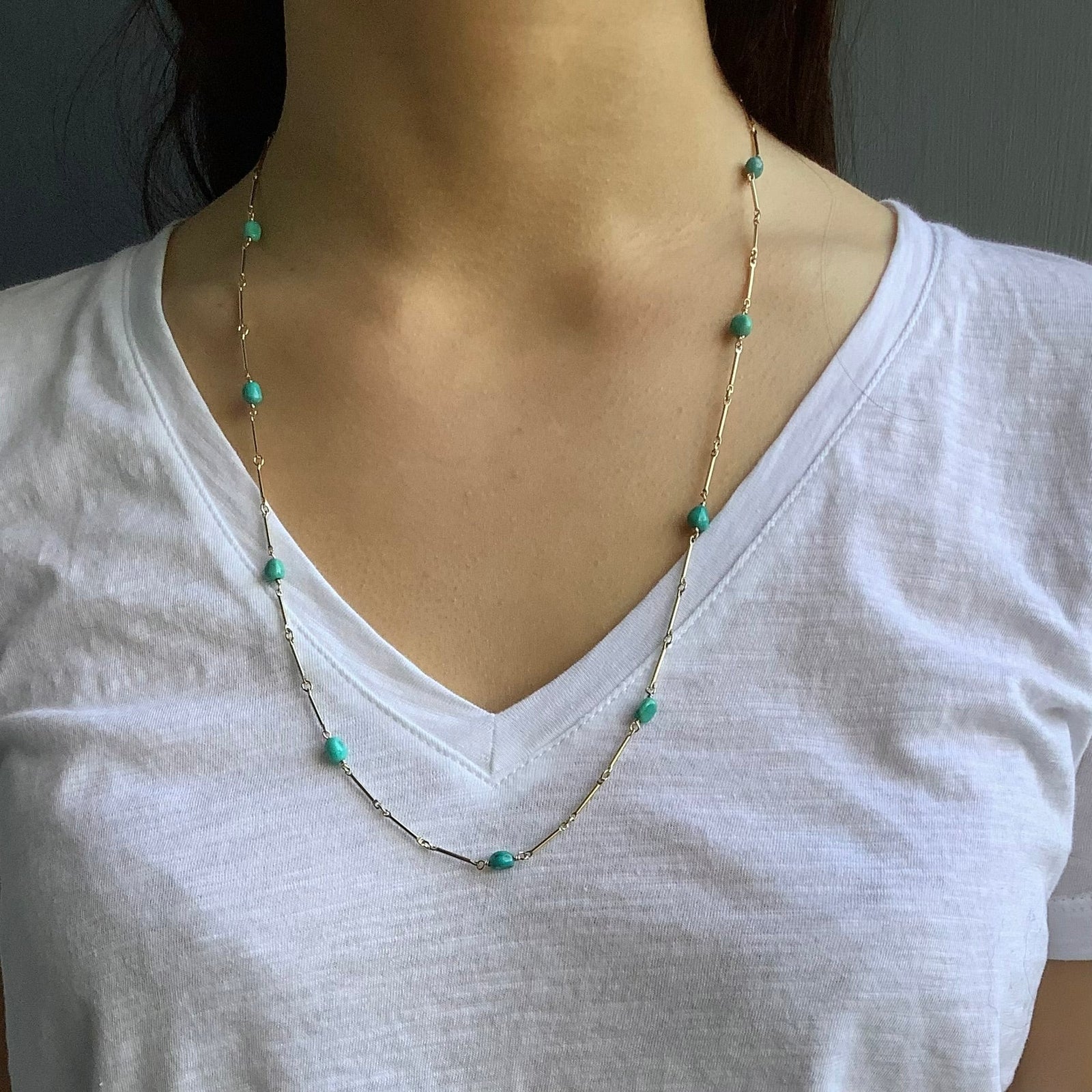 Necklace with turquoise beads on a white background