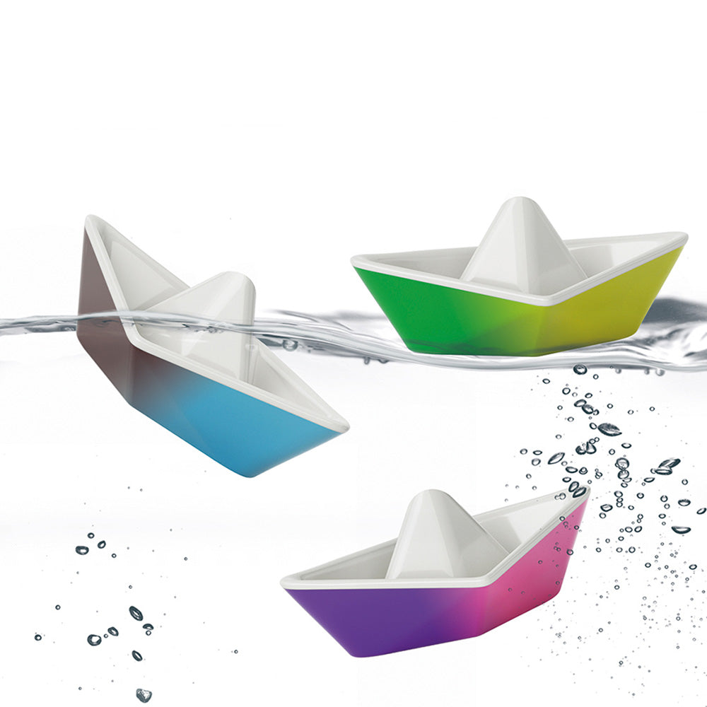 A photo of the three included boats bobbing in water, by Kid O.