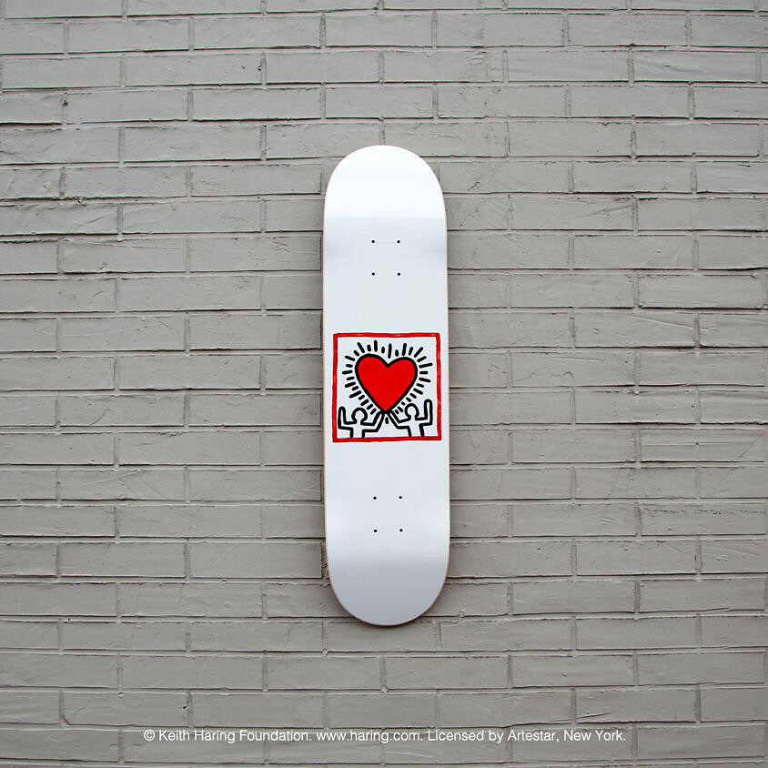 The Keith Haring Heart Skateboard's deck displayed.
