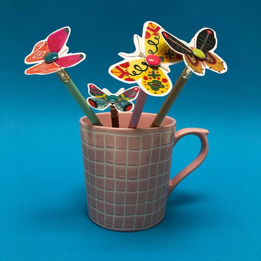 Crafted paper butterflies from The Kids&#39; Book of Paper Love on pencils in a coffee cup.