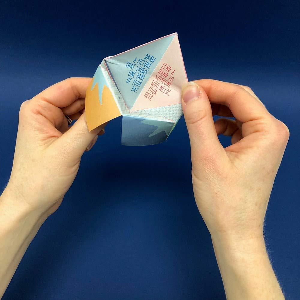 A pair of hands uses the paper fortune-teller from The Kids&#39; Book of Paper Love. 