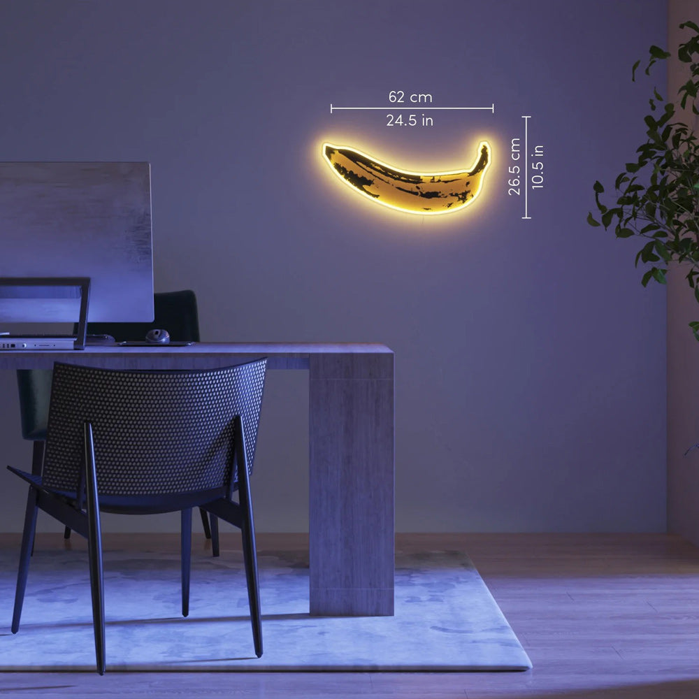 Banana light in office setting with dimensions on light.