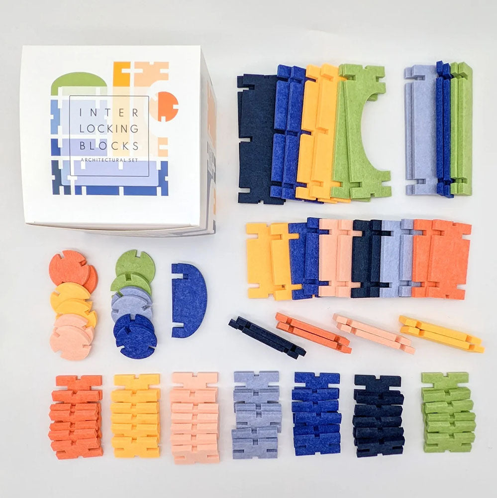 Full display of the varying colored and shaped pieces in &#39;Interlocking Blocks Architectural Set&#39; by lowercase toys.