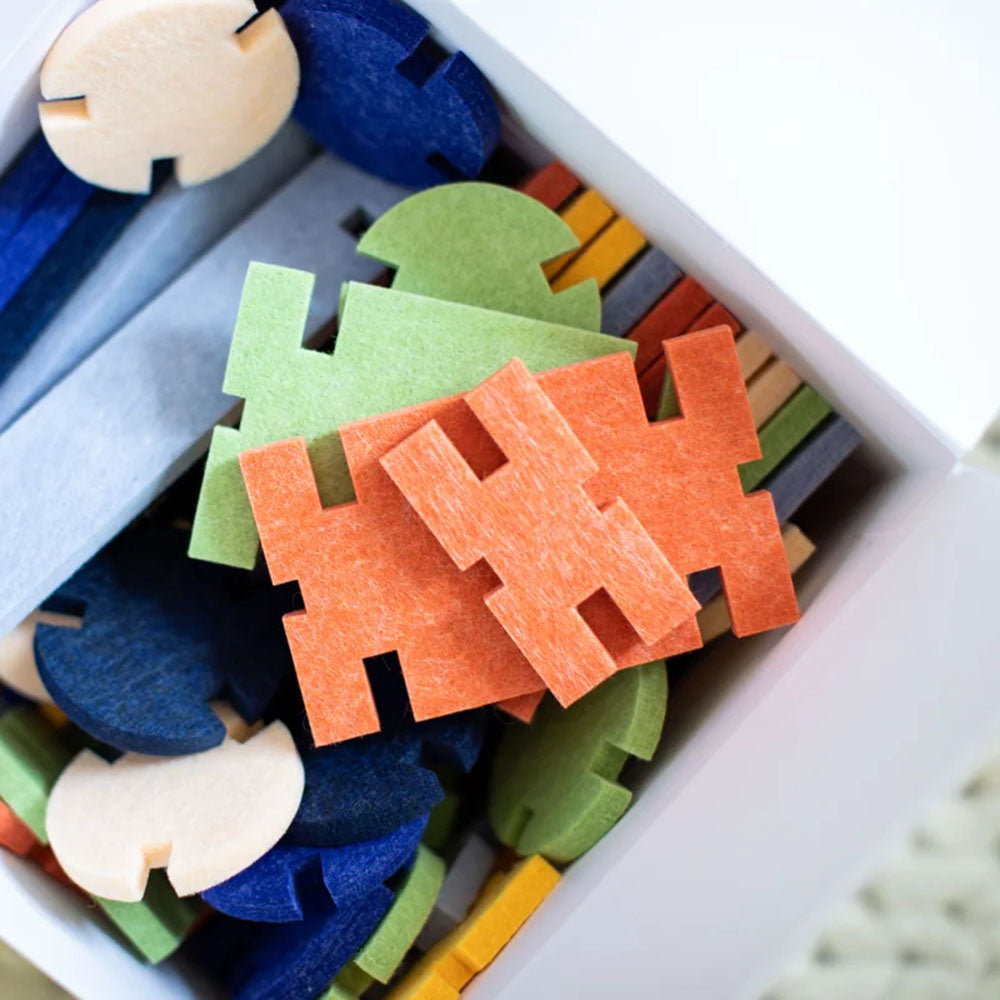 View of orange pieces from the box of &#39;Interlocking Blocks Architectural Set&#39; by lowercase toys.