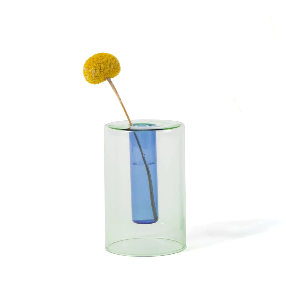 Small Reversible Vase in reverse with a flower.