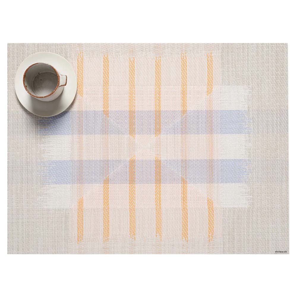 Mesa Opal placemat, soft blue and white stripes horizontal, with smaller orange vertical stripes. Two white triangles overlay.