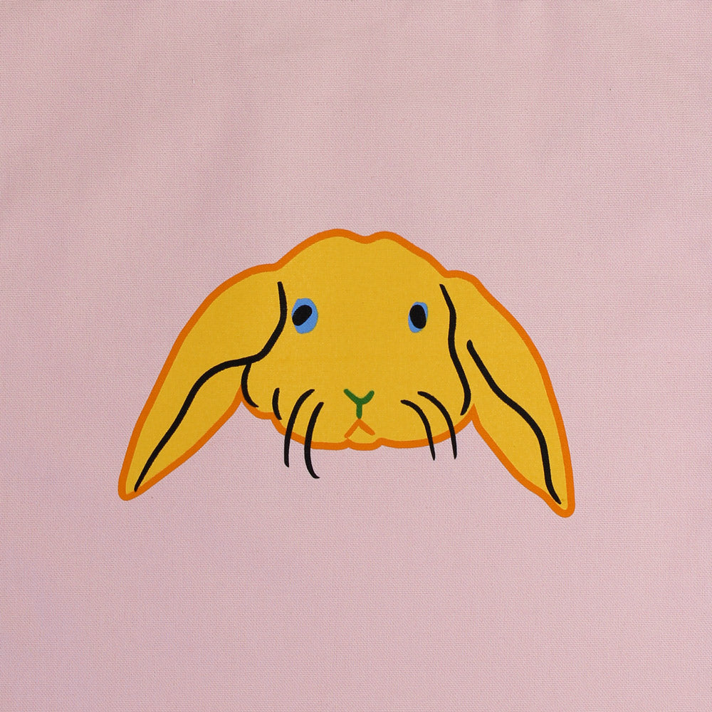Closeup view of rabbit graphic on tote.