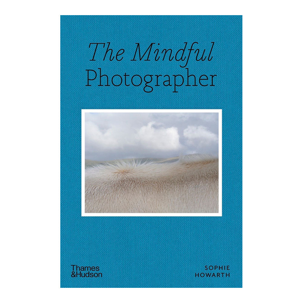 Cover of &#39;The Mindful Photographer&#39;, blue cover with photograph of windy grass field.