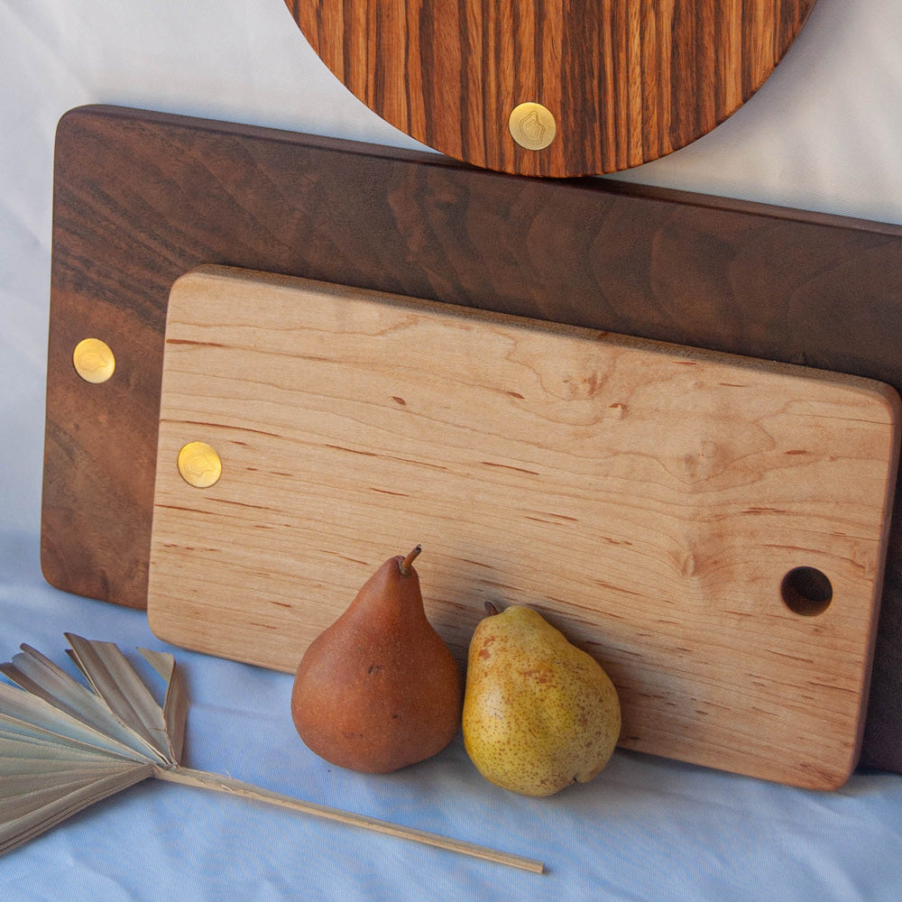 Cheese board with other wood boards lifestyle photo.