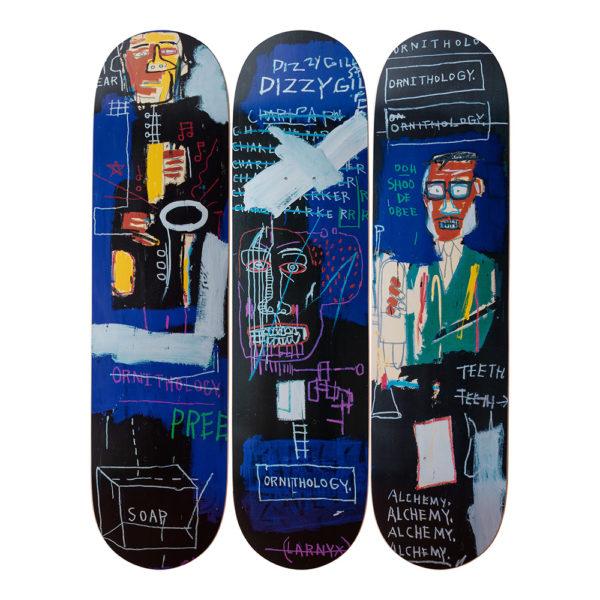 The Basquiat Horn Players Triptych Skateboards skate decks on display.
